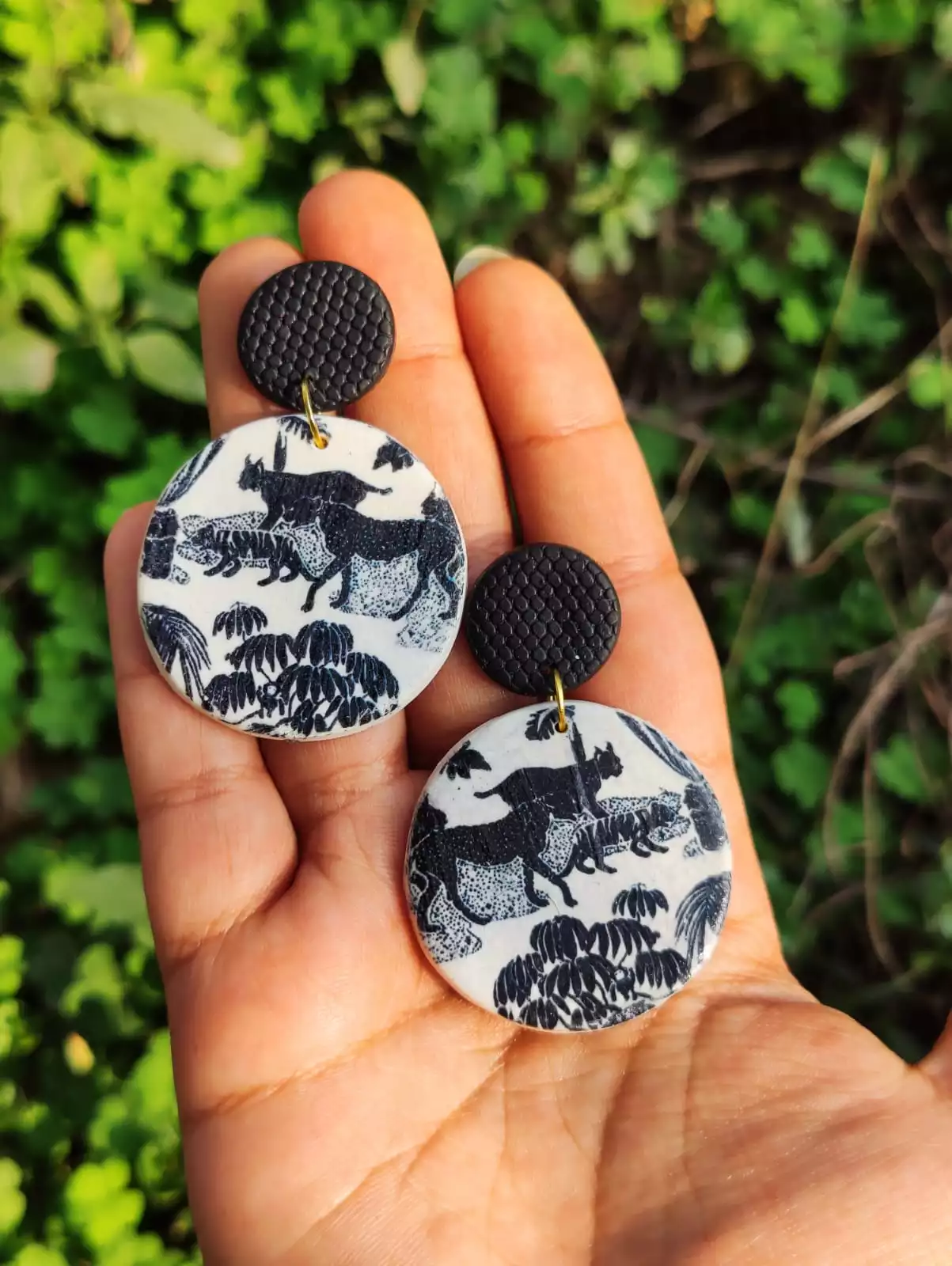 Black and white cheetah print handmade earrings in Pakistan is a secret to an enchanting look. Radiate your charm with these round unique pieces of art by SEA.