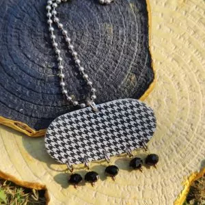 Black and white long houndstooth necklace with beaded chain is a universally-loved style.