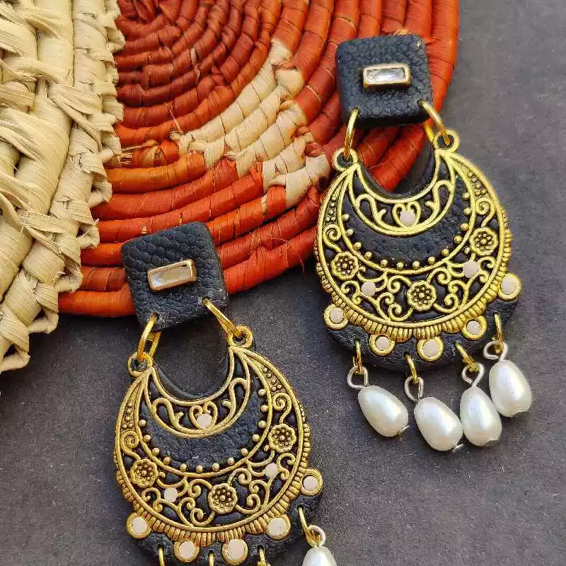 Get yourself festival ready with our big chunky earrings in charcoal black. Adorned with pearls and stones, hover a magic of our handmade earrings on your ear. Light-as-feather, party all day in your best looking self without feeling tired.