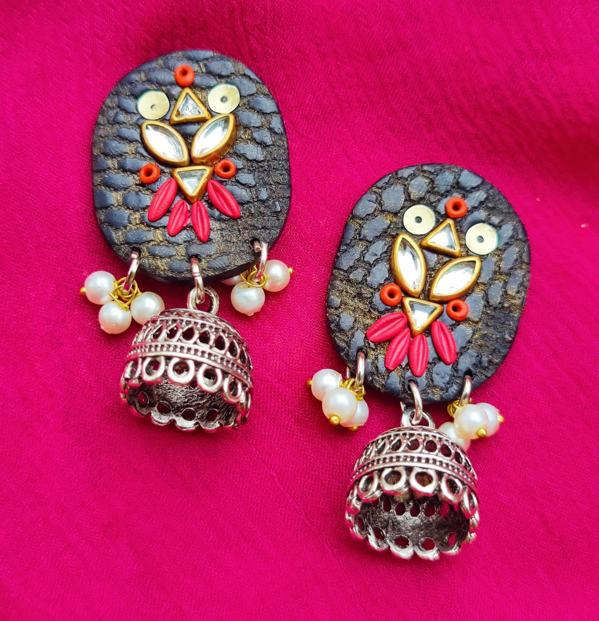 Handmade and lightweight Oval-Shaped Pearl Jhumka Earrings in Black and Pink.
