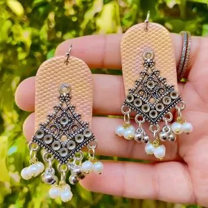 Handmade ethnic fusion statement earrings in peach and antique silver finish for festival fashion.