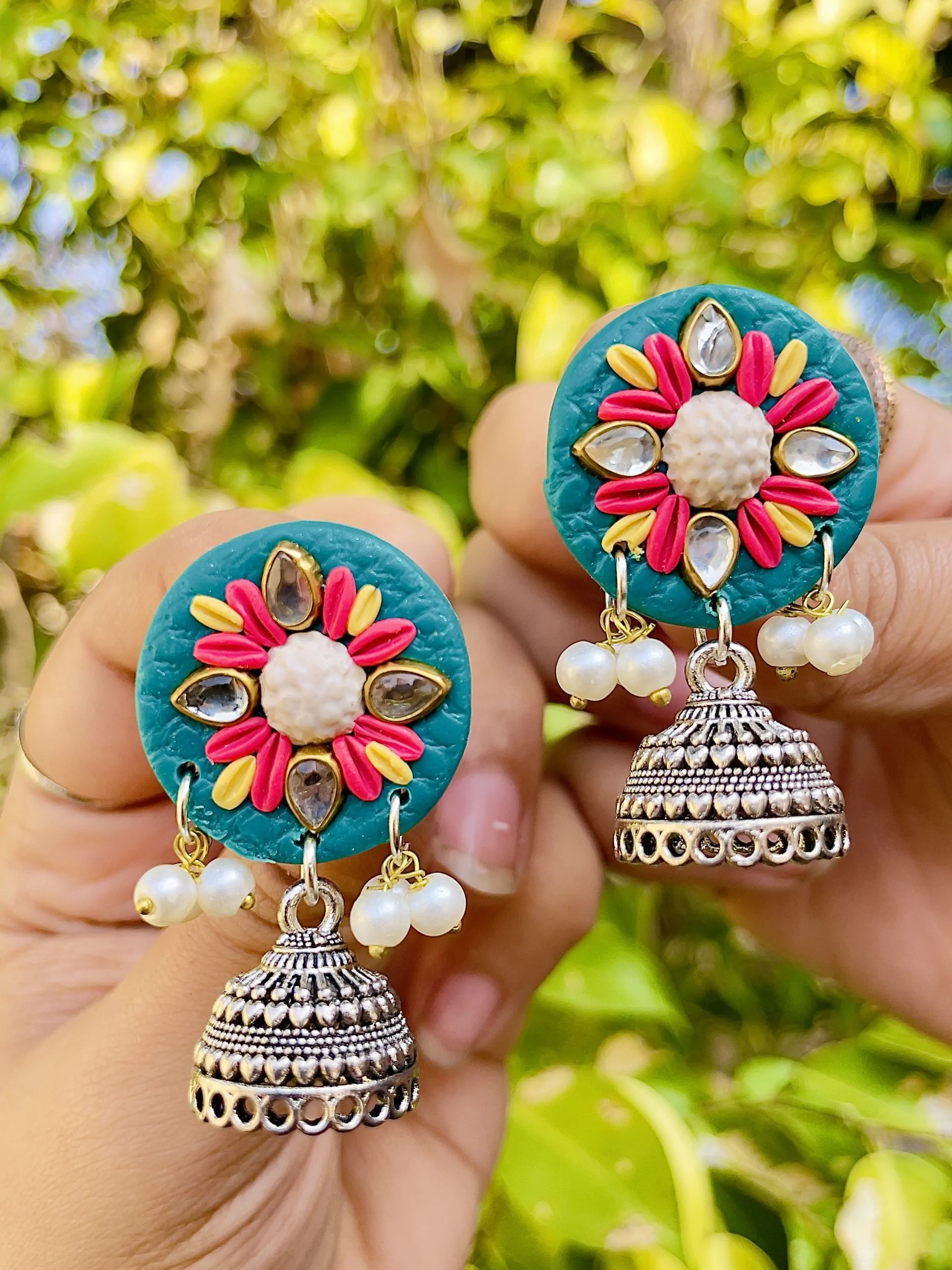 Handcrafted textured Jhumka earrings in various colors and geometric shapes.