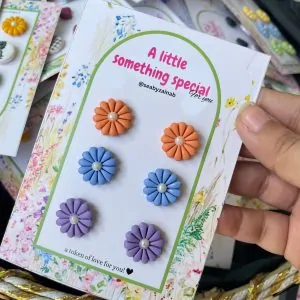 Handmade orange, blue, and purple floral stud earring pack.