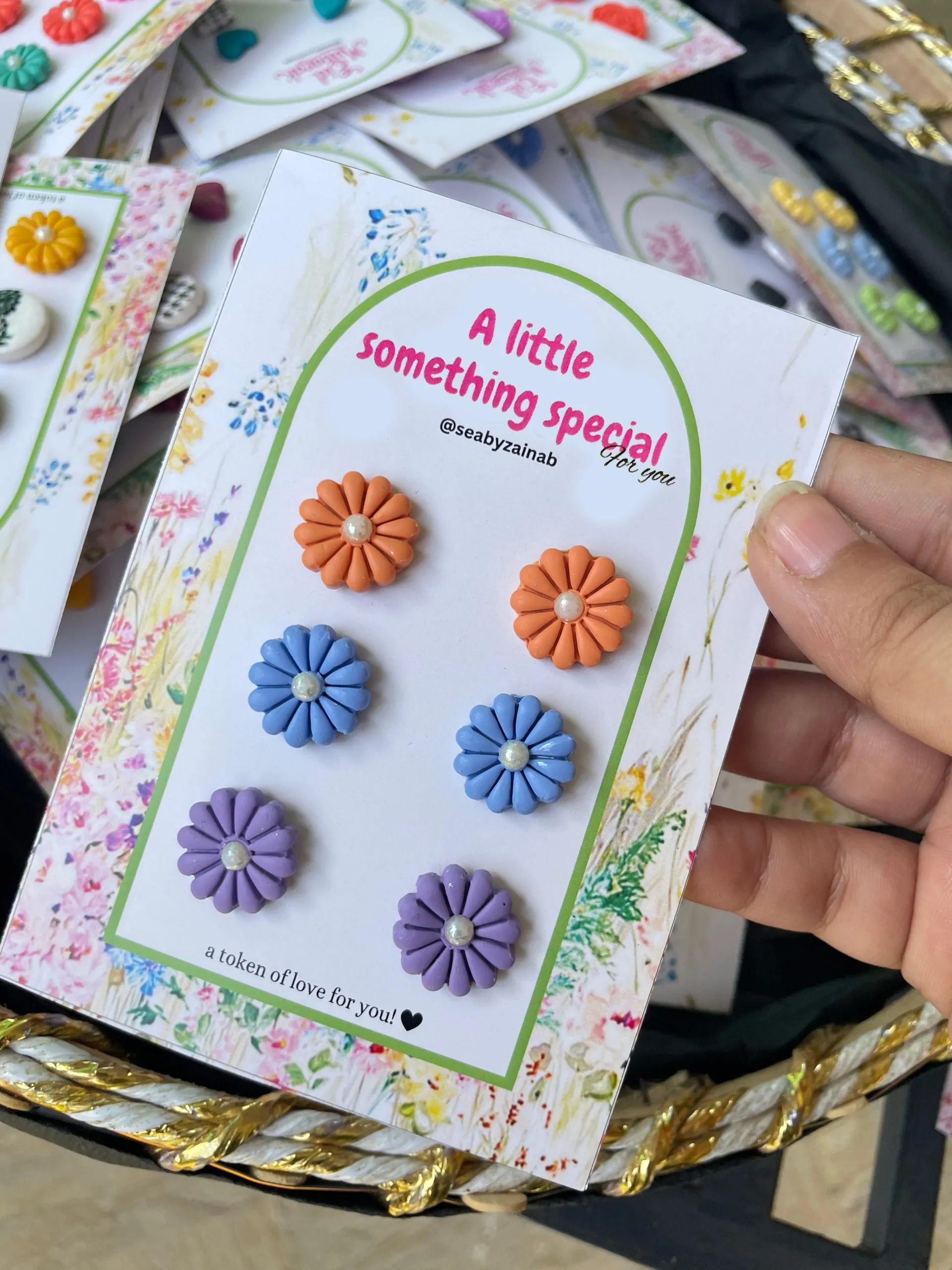 Handmade orange, blue, and purple floral stud earring pack.