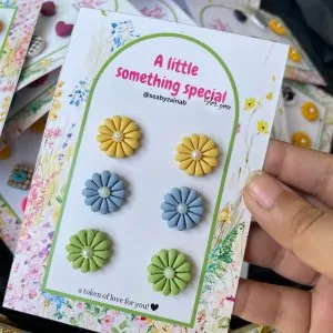 3-pair set of yellow, blue, and green flower earrings on gift card.