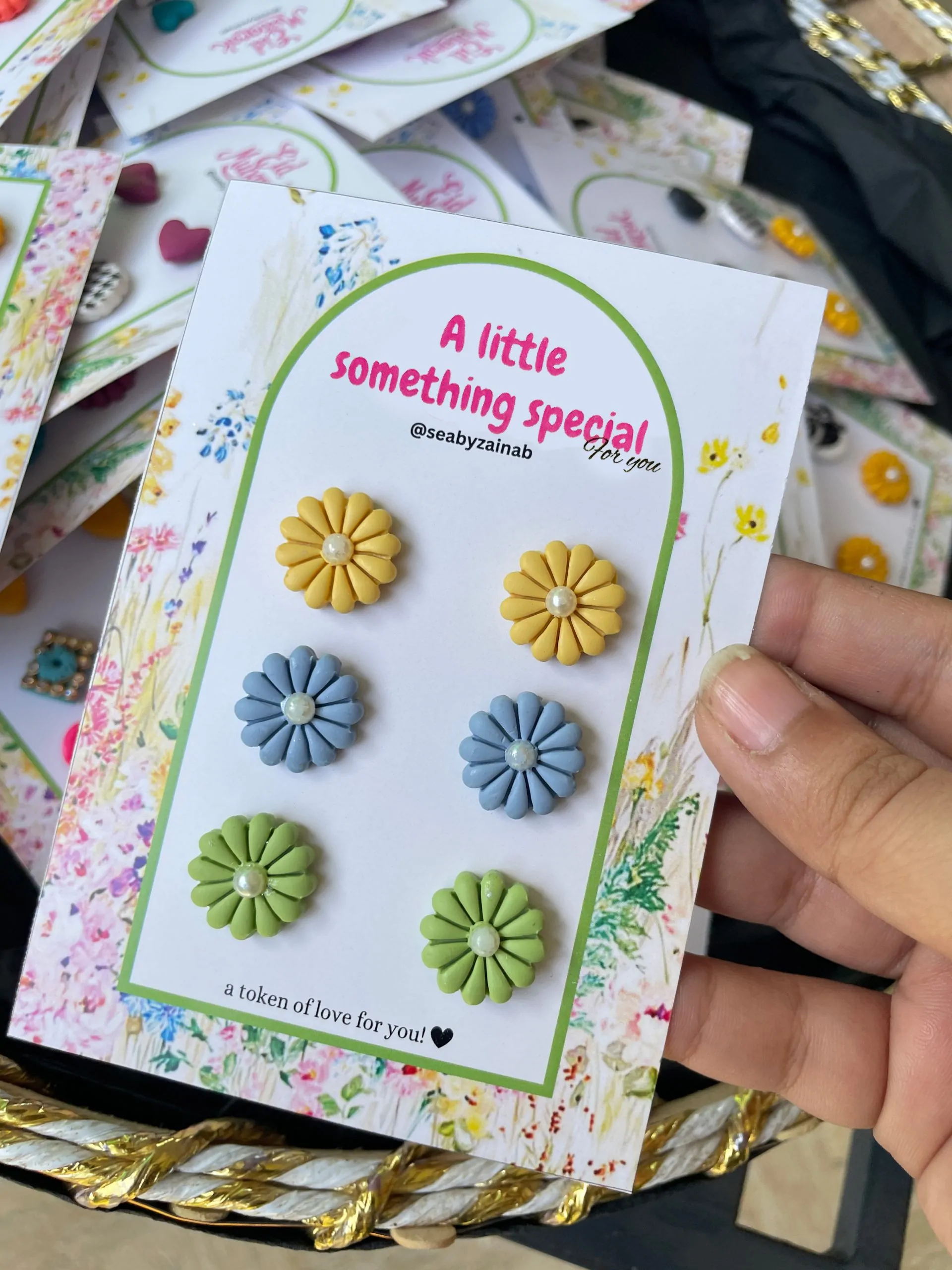 3-pair set of yellow, blue, and green flower earrings on gift card.