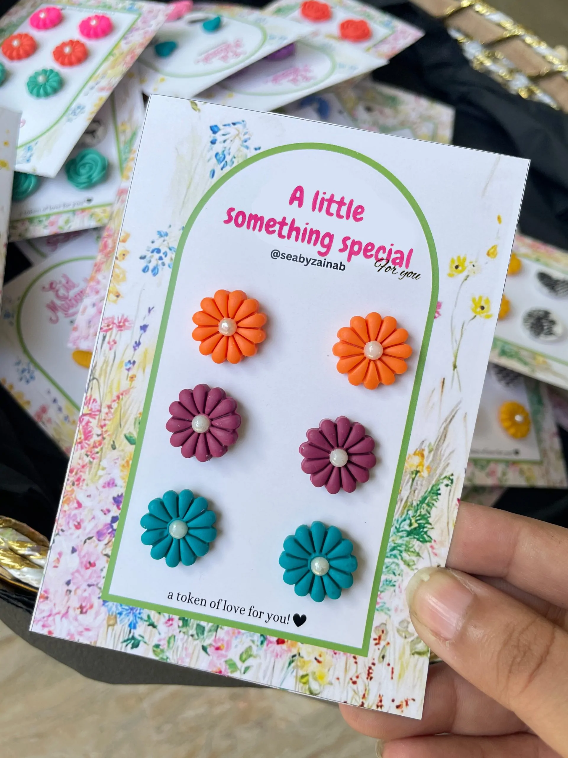 Vibrant orange, plum, and teal handcrafted floral studs.