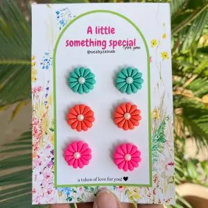 Handmade teal, coral, and pink floral stud earring set.