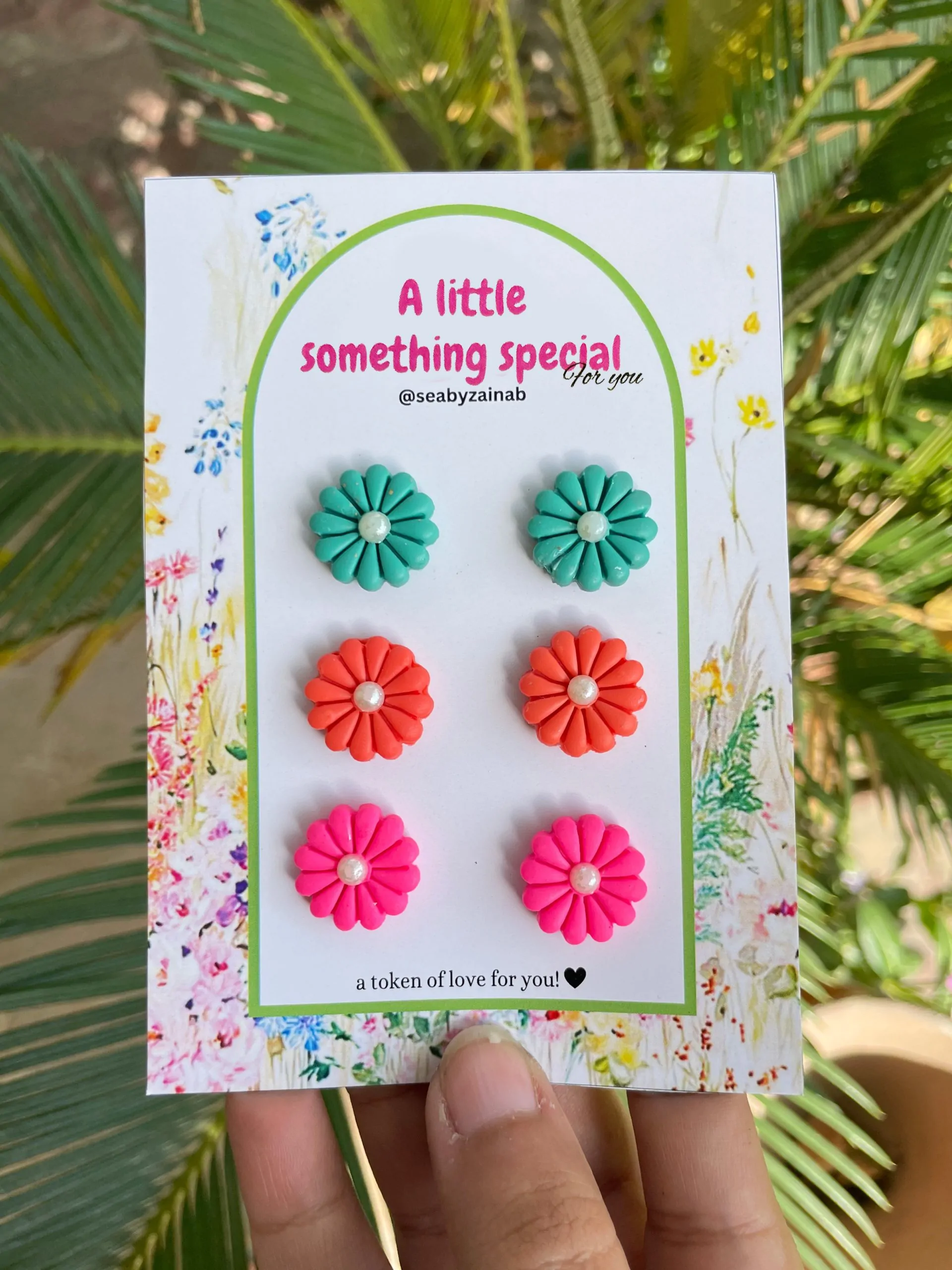 Handmade teal, coral, and pink floral stud earring set.