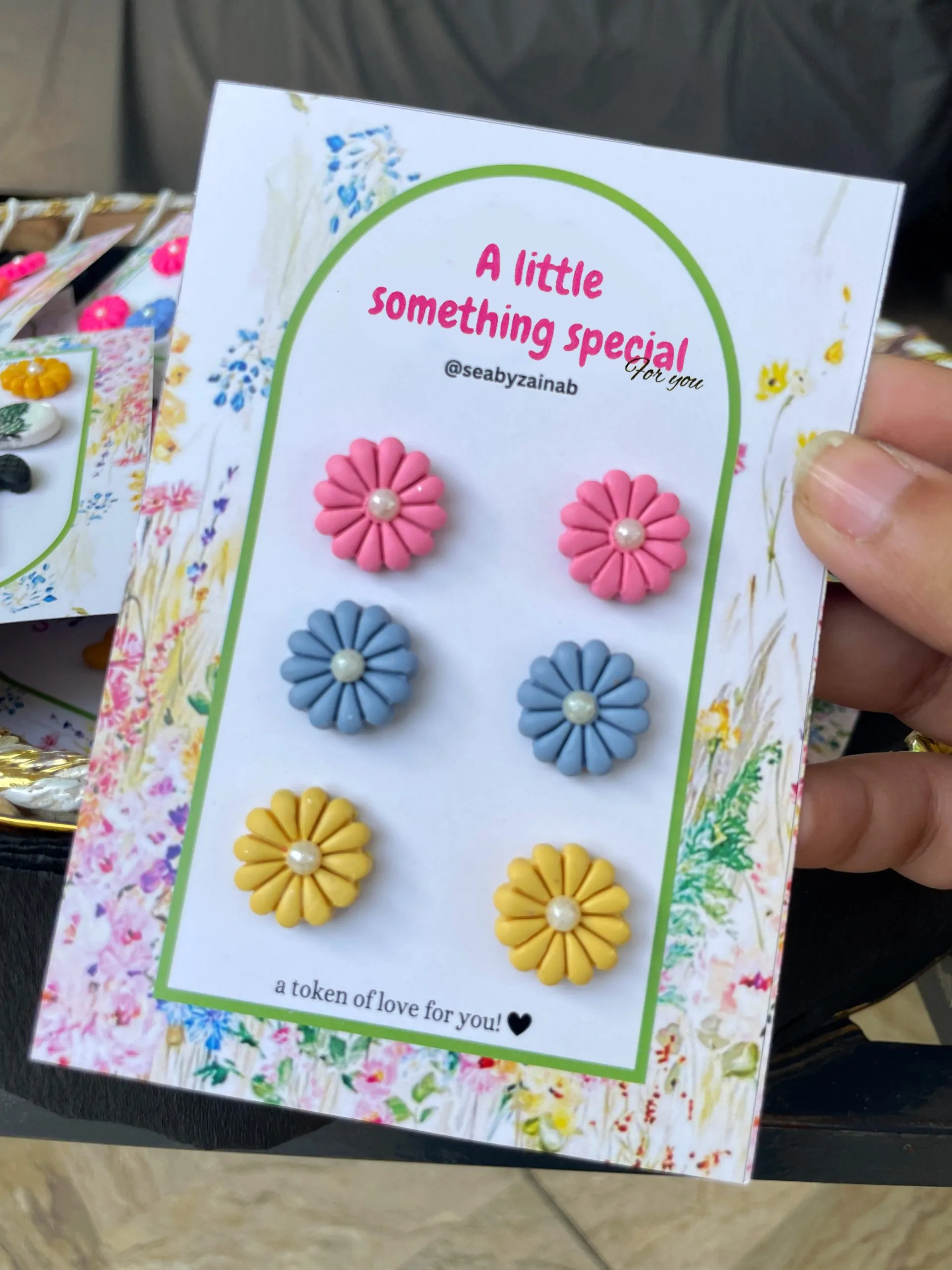 Pink, blue, and yellow handmade floral stud earring trio.