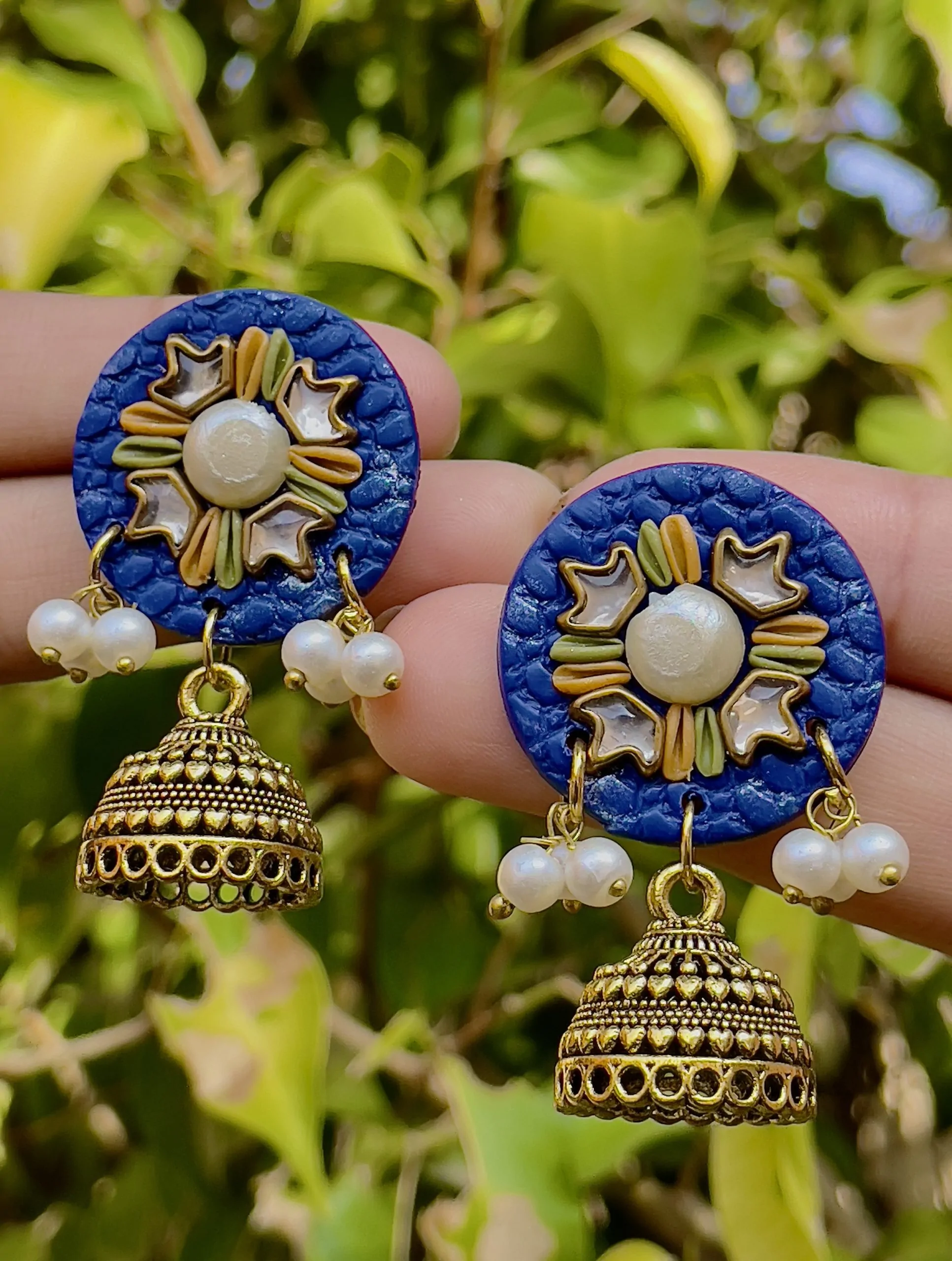 Royal Blue round textured earrings with gold Jhumka bells and star mirrors.