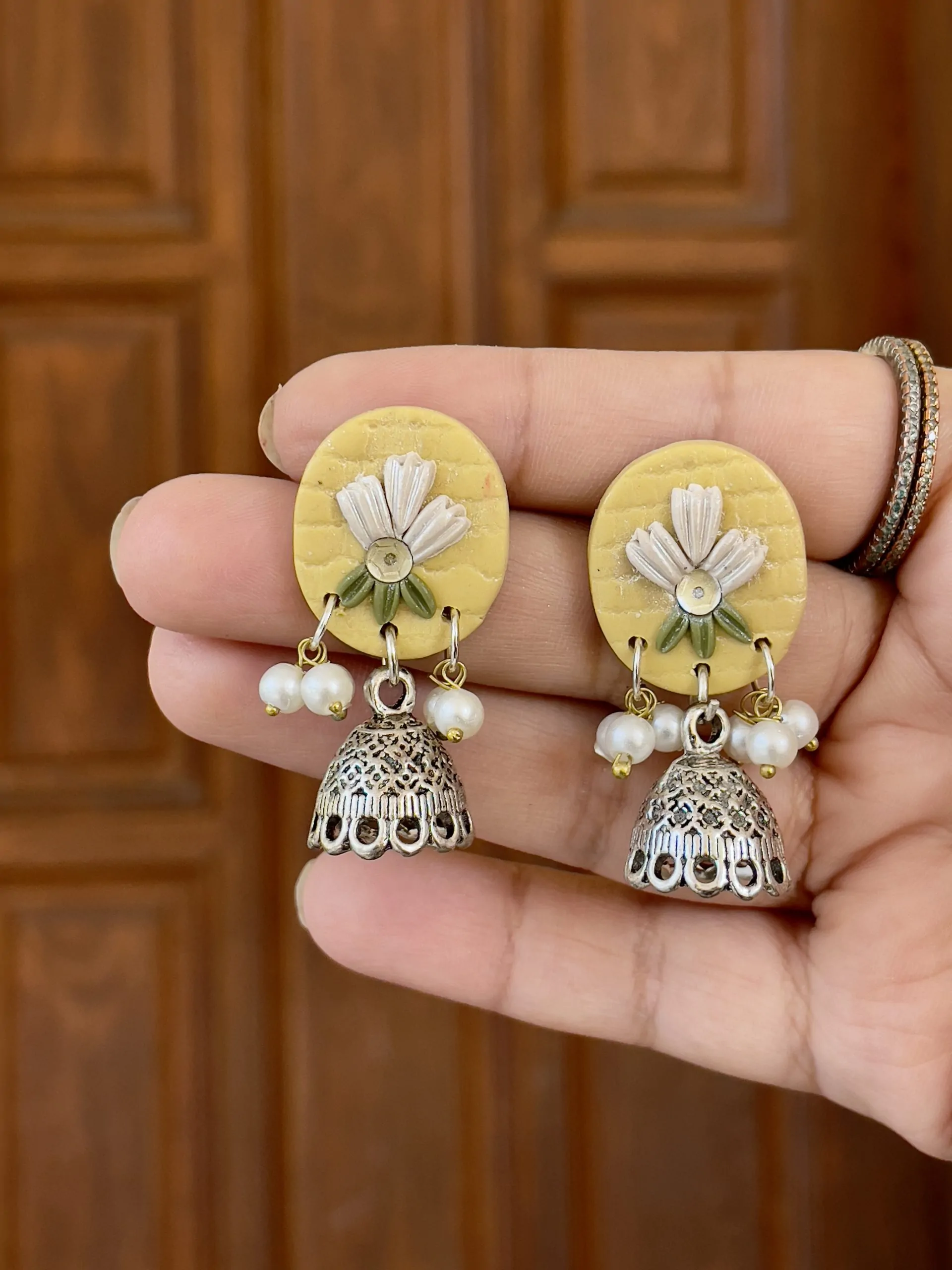 Butter Yellow Textured Circular Jhumkas