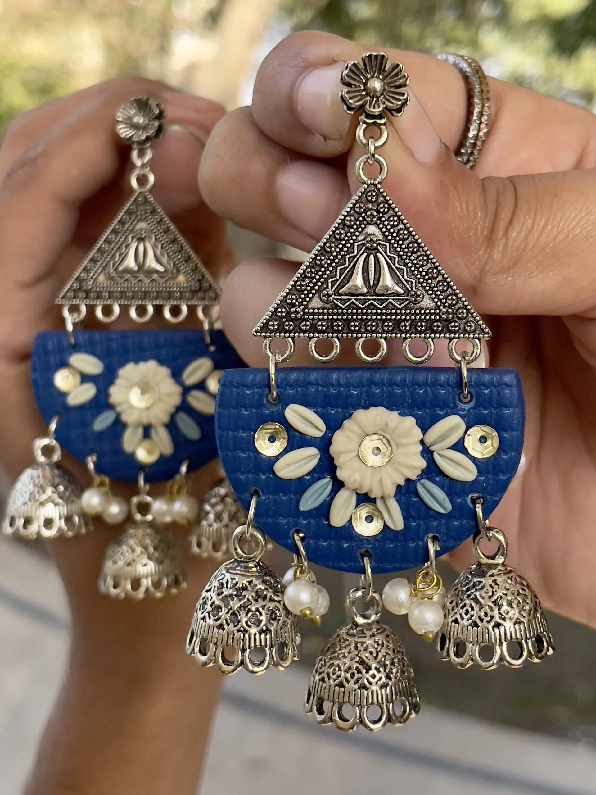 Royal Blue half-moon chandelier earrings with silver triangle and 3 Jhumka bell drops